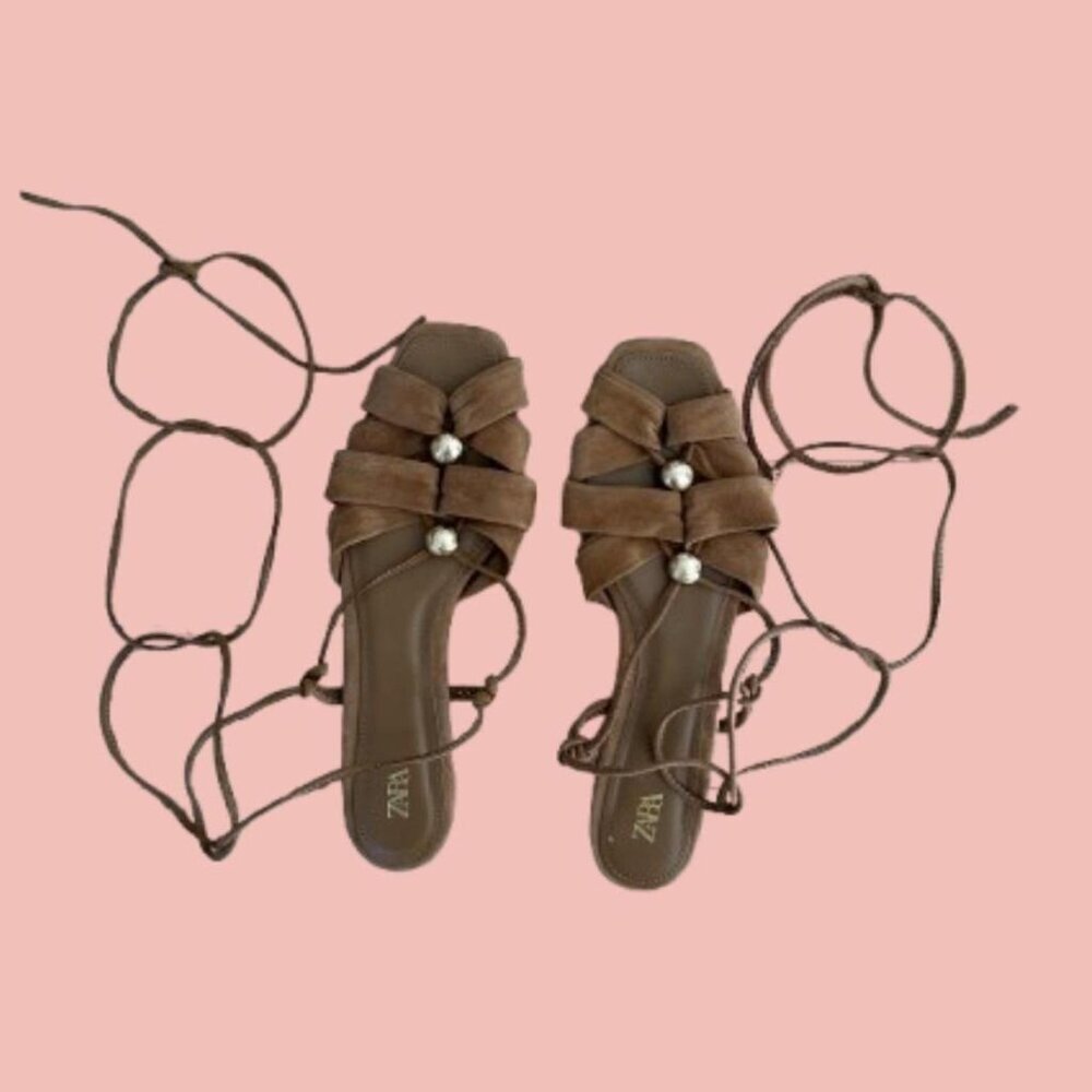 Greek-inspired lace-up sandals in soft faux suede with gold button details